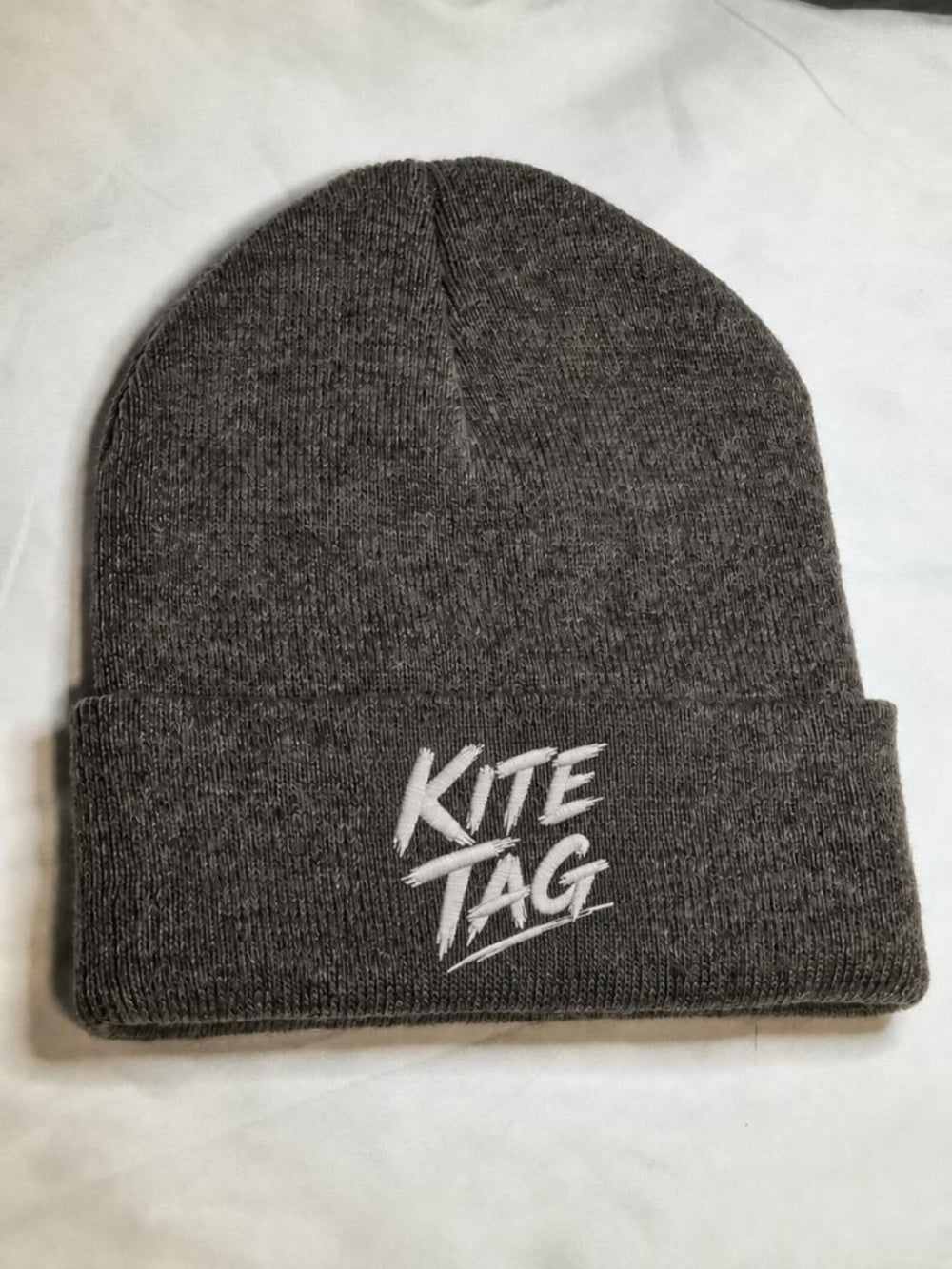 Charcoal cuffed beanie with custom white embroidered lettering