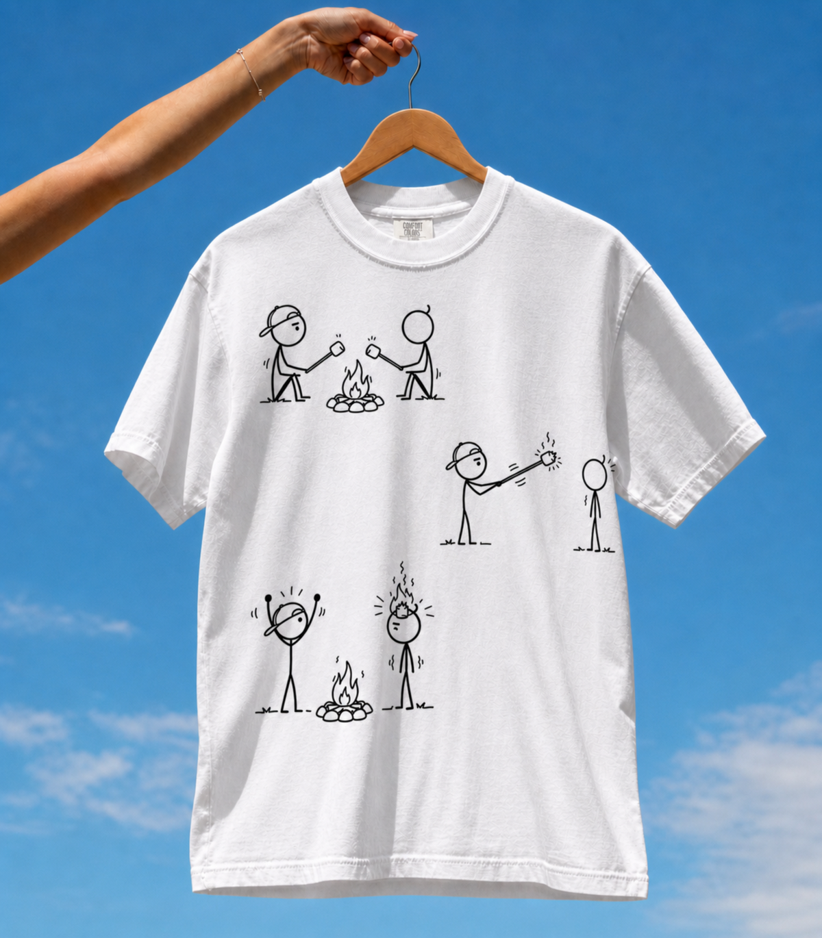 Tuft & Brow Marshmallow design on the front of a white T-shirt, with three staggered comic scenes