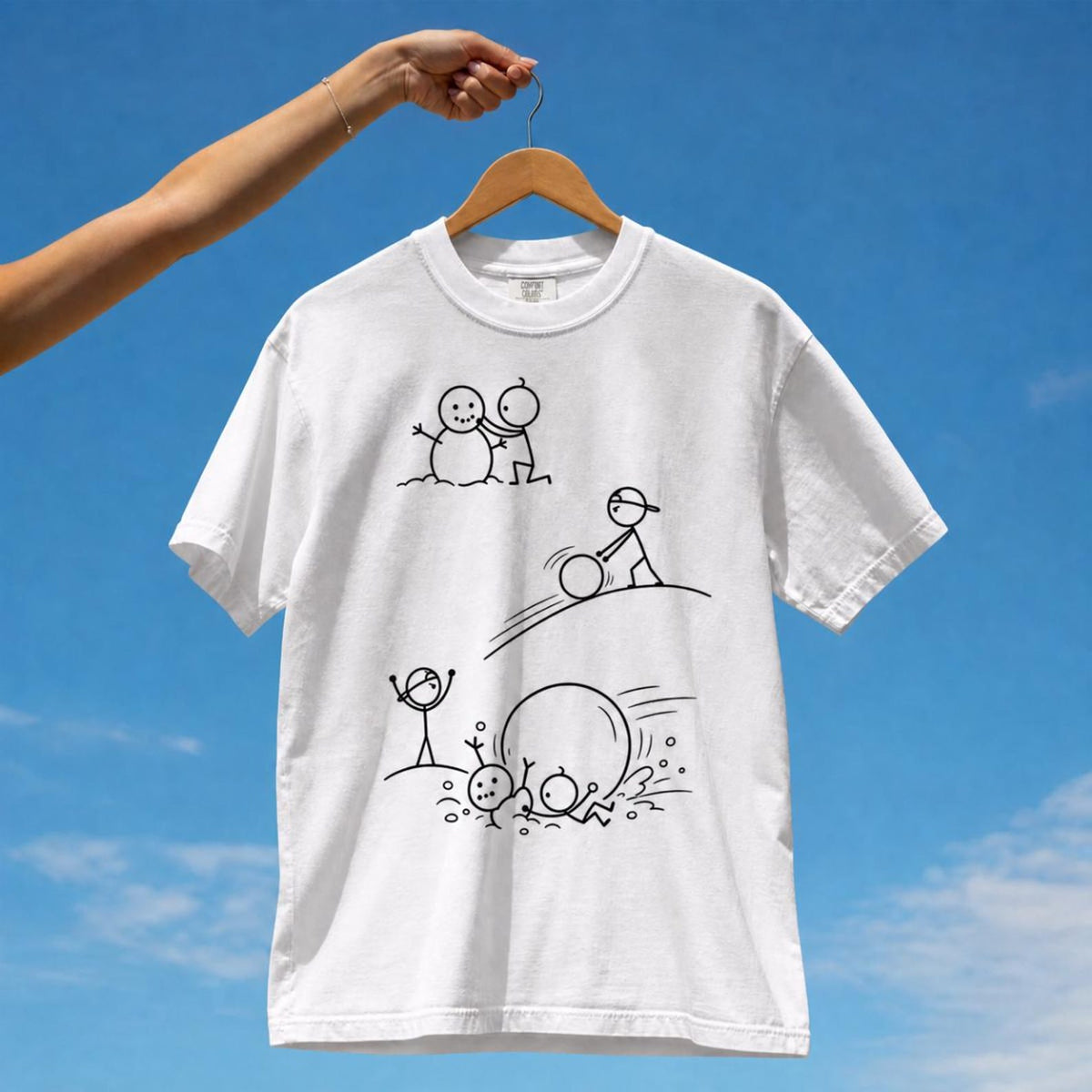Tuft & Brow Snowman comic T-shirt mockup on white, showing three staggered scenes